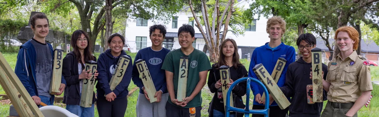 Volunteer crew holding marker posts